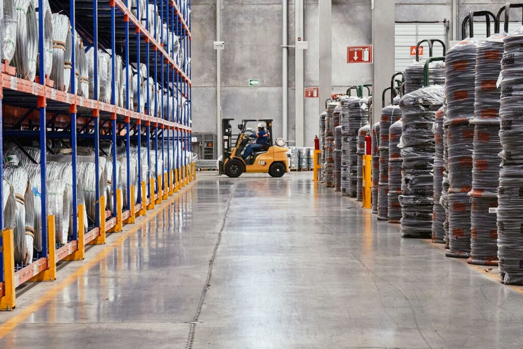Industrial warehouse interior with forklift and organized storage racks