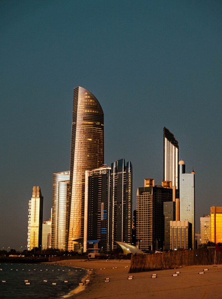 Abu Dhabi skyline at sunset with modern towers and waterfront